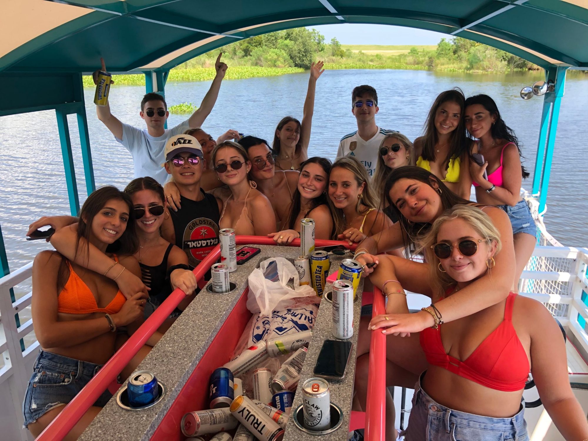 a group of people on a boat posing for the camera
