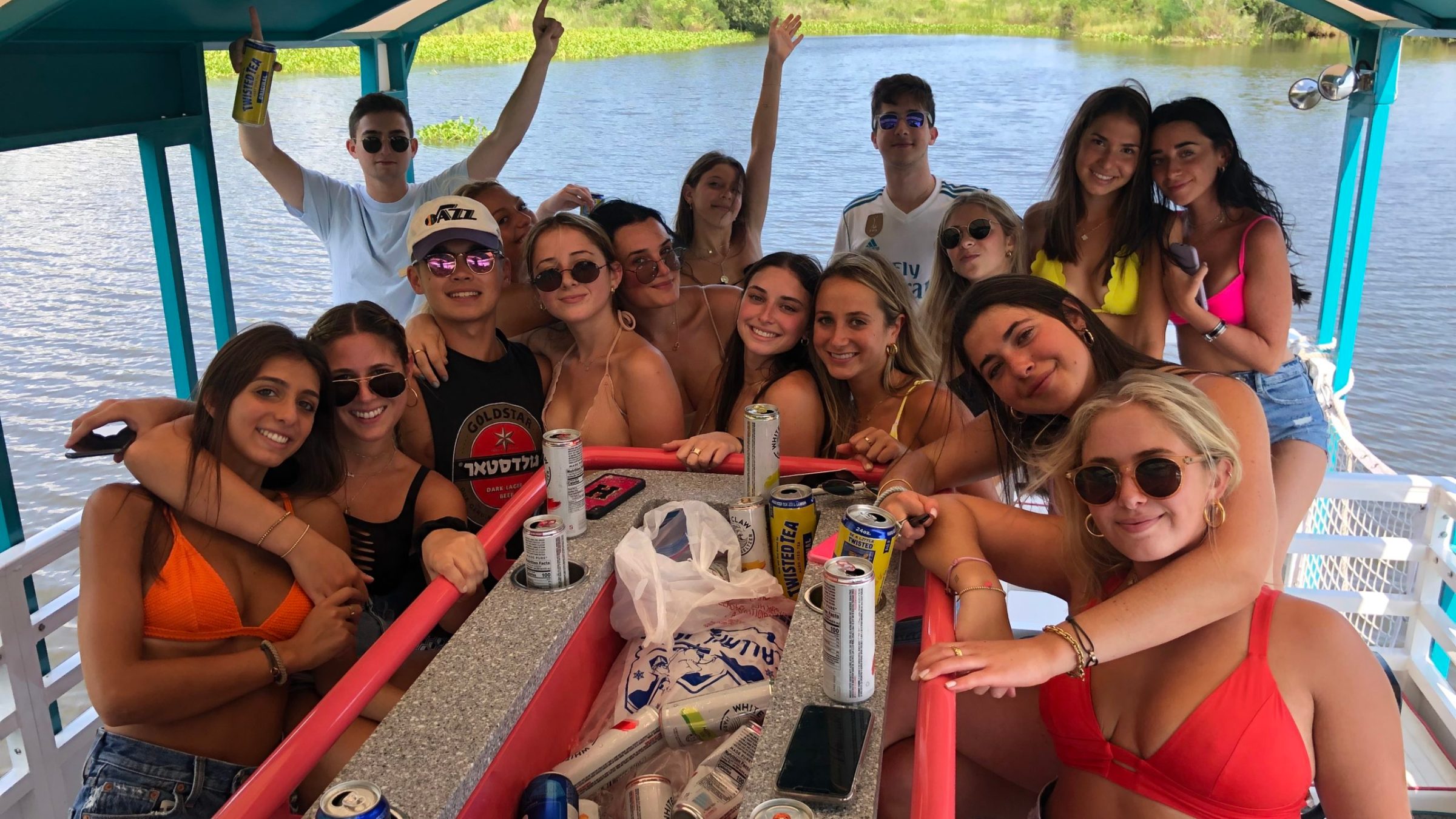 a group of people on a boat posing for the camera